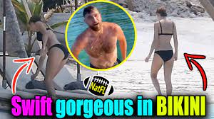 Breaking News: During a romantic trip to the Bahamas, Taylor Swift shares a passionate kiss with Travis Kelce while flaunting her incredibly toned physique in a tiny yellow bikini...